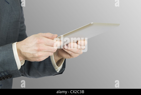 hands holding and pointing on contemporary digital frame with blank screen Stock Photo