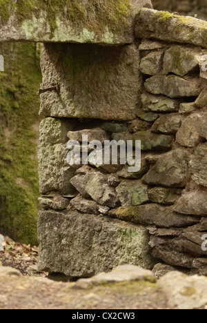 Light coming through a gap in a disused gunpowder factory building Stock Photo