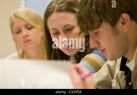 College students attend a class in a classroom Stock Photo