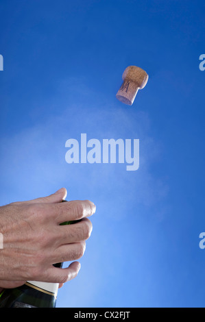 Champagne cork popping, high-speed image Stock Photo