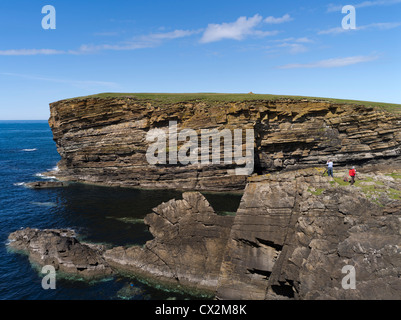 dh Brough of Bigging YESNABY ORKNEY Tourist family on seacliff tops blue sky sea cliffs holiday tourists scotland summer outdoors