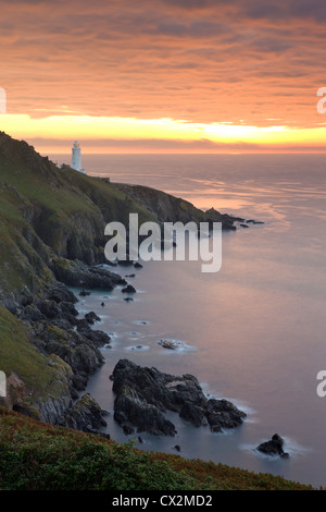 Spectacular sunrise behind Start Point Lighthouse in South Hams, Devon, England. Autumn (September) 2010. Stock Photo