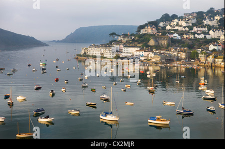 Early morning sunlight on Salcombe and the yachts in Kingsbridge Estuary, South Hams, Devon, England. Autumn (September) 2010. Stock Photo