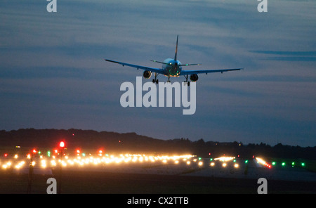 Passenger airplane approaching Düsseldorf International Airport. Germany. Stock Photo