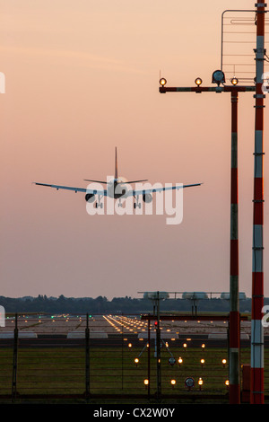 Passenger airplane approaching Düsseldorf International Airport. Germany. Stock Photo