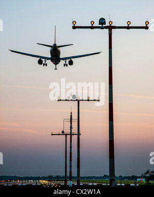 Passenger airplane approaching Düsseldorf International Airport. Germany. Stock Photo