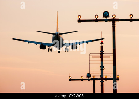 Passenger airplane approaching Düsseldorf International Airport. Germany. Stock Photo