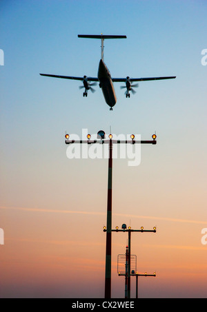 Passenger airplane approaching Düsseldorf International Airport. Germany. Stock Photo