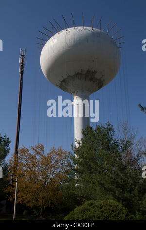 Water tower being repaired and painted Stock Photo