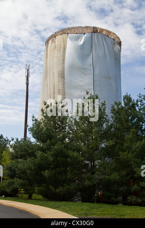 Water tower being repaired and painted Stock Photo