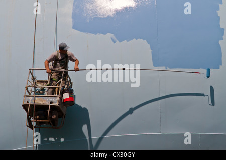 Water tower being repaired and painted Stock Photo