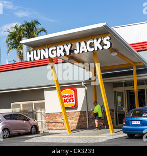 Man leaving Hungry Jacks at Sunshine Coast, Queensland, Australia. Stock Photo