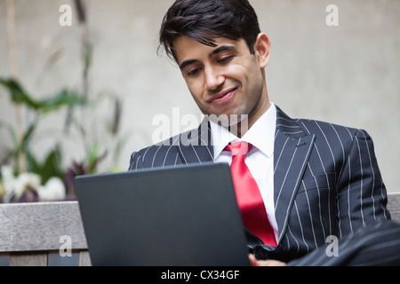 An Indian businessman using tablet PC Stock Photo