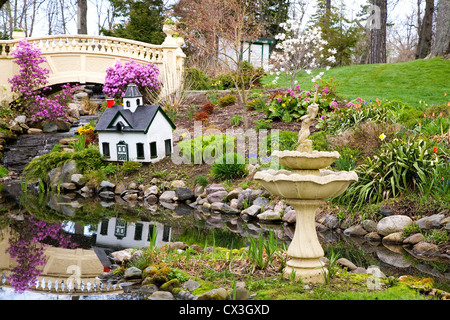 A view of a park in early springtime. Focus is on the fountain. Stock Photo