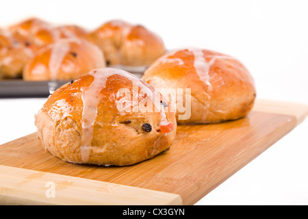 An Easter time treat, traditional homemade hot cross buns. Stock Photo