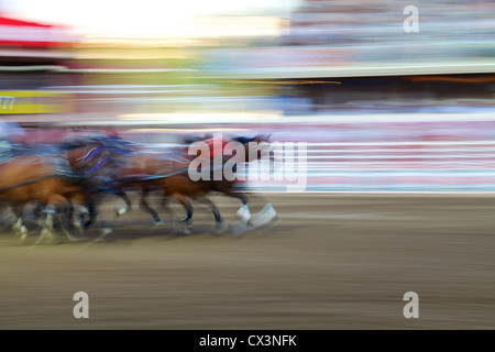 Blur motion of horses during Chuckwagon race at Calgary stampede, Alberta, Canada Stock Photo