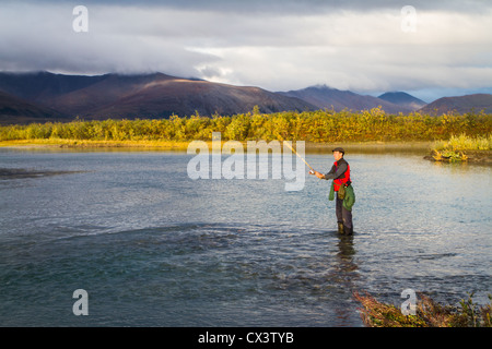 A man fishes in the Noatak River in Noatak National Preserve, Alaska, USA. Stock Photo