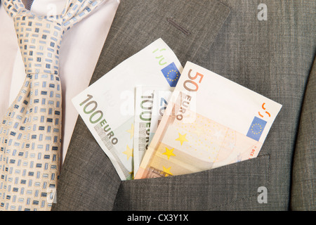 Business man with money in the pocket Stock Photo