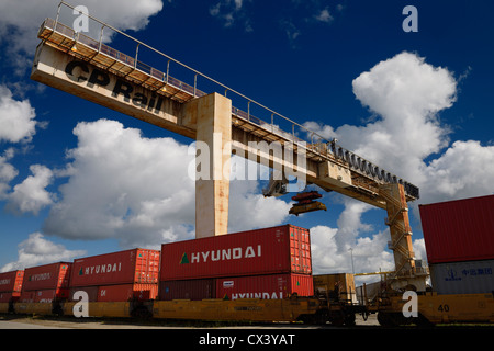 A line of intermodal container well cars through the BNSF rail yard in ...