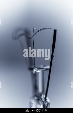 Toned Macro shot of the fillament support structure of an incandescent lightbulb. Stock Photo