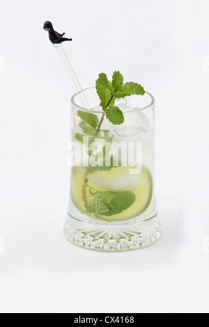 Mojito cocktail with lime slices and mint leaves on white background Stock Photo