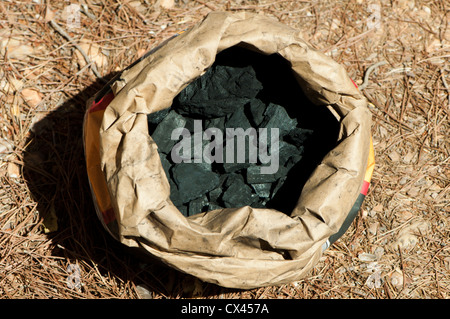 Natural charcoal in paper envelope close up. Stock Photo