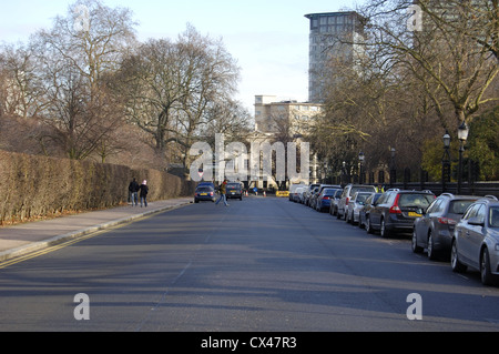Cars parked on street in Regents Park, London, England Stock Photo