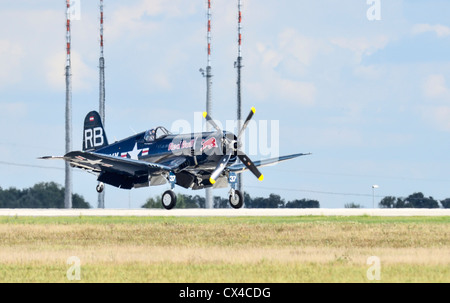 Chance Vought F4U Corsair fighter aircraft in flight during landing at Berlin air show (ILA). Tele photo shot. Stock Photo