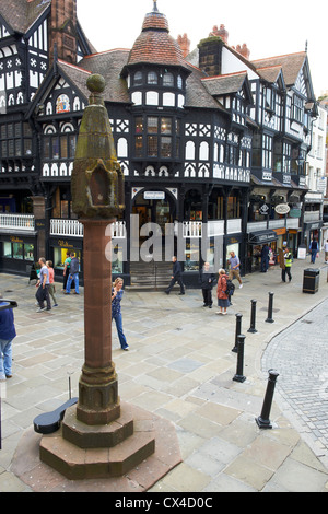 Entrance to Eastgate Row and Bridge Street Row with the cross in the foreground Chester Cheshire UK Stock Photo