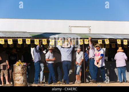 Bush locals drink at the bar during the Birdsville Races.  Birdsville, Queensland, AUSTRALIA Stock Photo