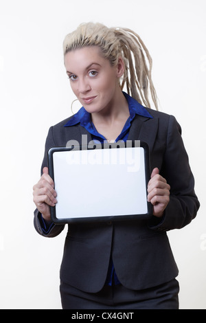 Business person with dreadlock hair holding out a small white board with a blank area for sign or copyspase Stock Photo