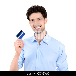 Young handsome man showing credit card. Isolated on white. Stock Photo