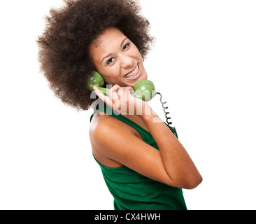 Afro-American young woman answering a call, isolated on white background Stock Photo