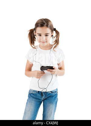 Little girl listen music with a MP3 player, isolated on white Stock Photo