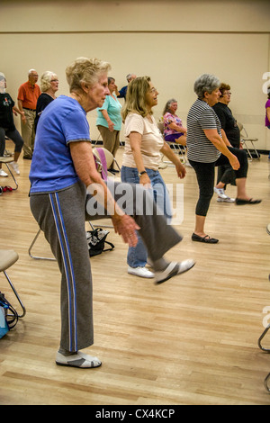 Senior women work out during an exercise class at a senior center in Tustin, CA. Stock Photo