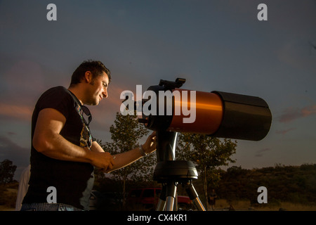 An amateur astronomer readies his 2,000mm catadioptic telescope for a look at the stars on an evening in Orange County, CA. Stock Photo