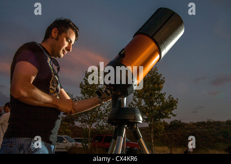 An amateur astronomer readies his 2,000mm catadioptic telescope for a look at the stars on an evening in Orange County, CA. Stock Photo