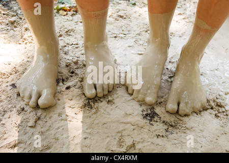 Feet in mud close-up Stock Photo