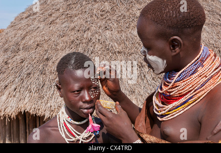 Korcho Ethiopia Africa village Lower Omo Valley Karo tribe putting on painted face #25 Stock Photo