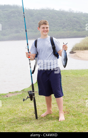 Happy teen boy holding fishing hi-res stock photography and images - Alamy