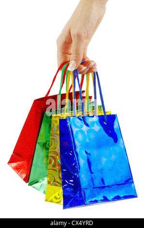 colorful shopping bags set in woman's hand isolated on white Stock Photo