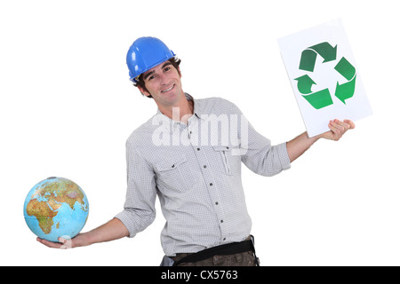 A female construction worker promoting recycling. Stock Photo