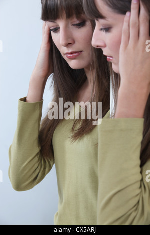 Mirror image of a woman Stock Photo