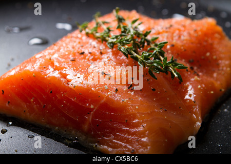 fresh trout fillet on a frying pan Stock Photo