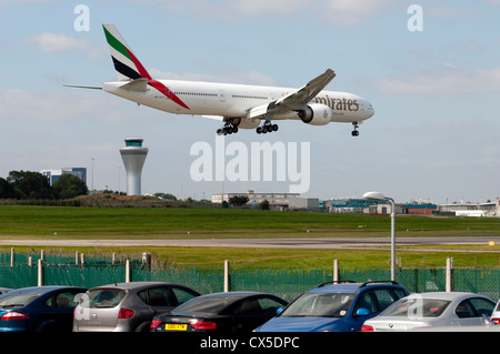 Emirates Boeing 777 aircraft landing at Birmingham Airport Stock Photo