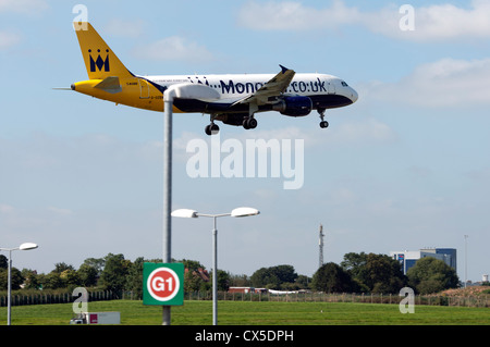 Monarch Airbus A320 landing at Birmingham Airport Stock Photo