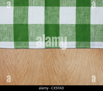 wooden kitchen table with green gingham tablecloth Stock Photo