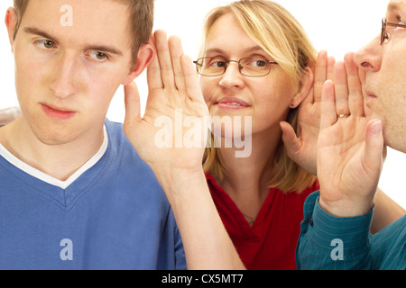 A person whispering something to another person Stock Photo