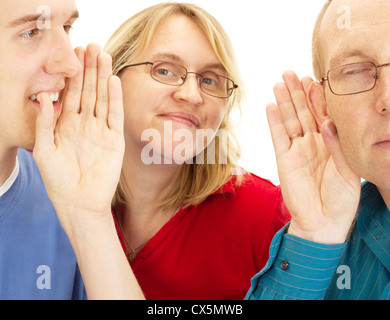 A person whispering something to another person Stock Photo