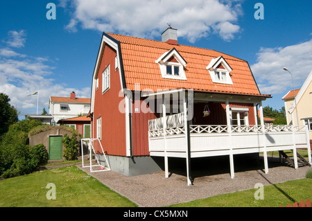 typical red swedish house houses home homes traditional timber wood wooden building buildings falun paint sweden Stock Photo